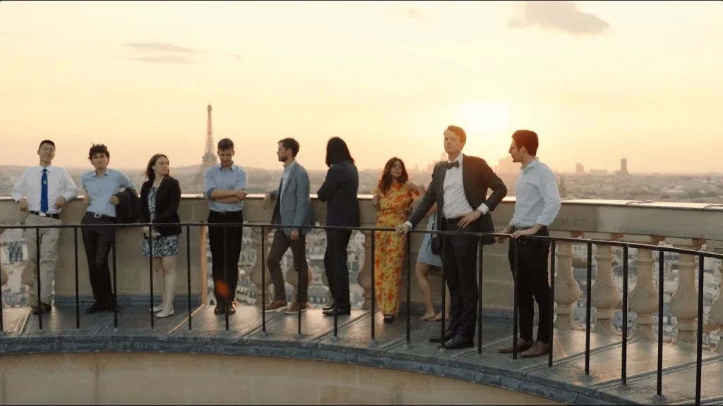 Academia Tocqueville 2023 fellows on a Paris rooftop facing the Eiffel Tower
